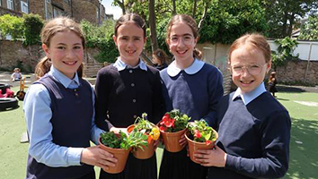 three girls with their plants